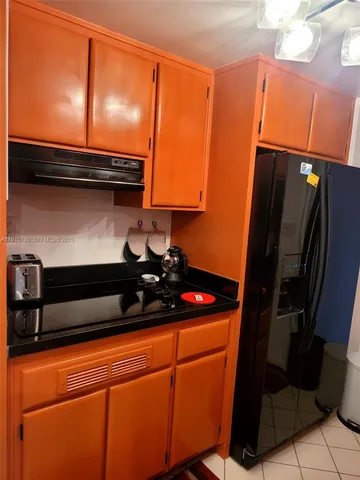 a bedroom with a bed and a table in it