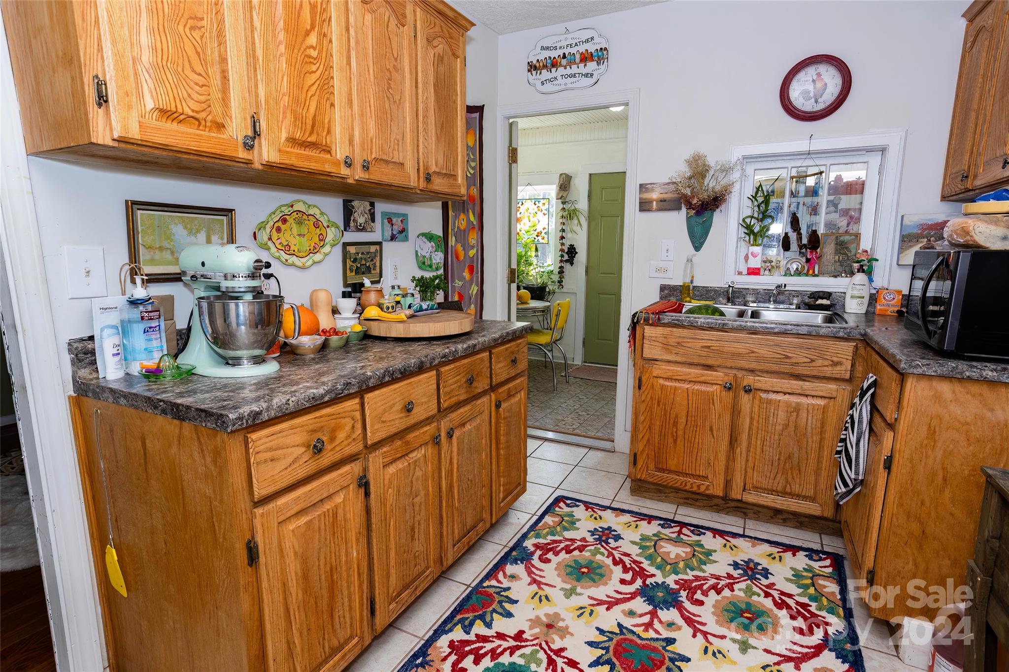 3786 Broad Street Clyde, NC 28721 - Photo 15 of 48 a kitchen with stainless steel appliances granite countertop a stove and cabinets