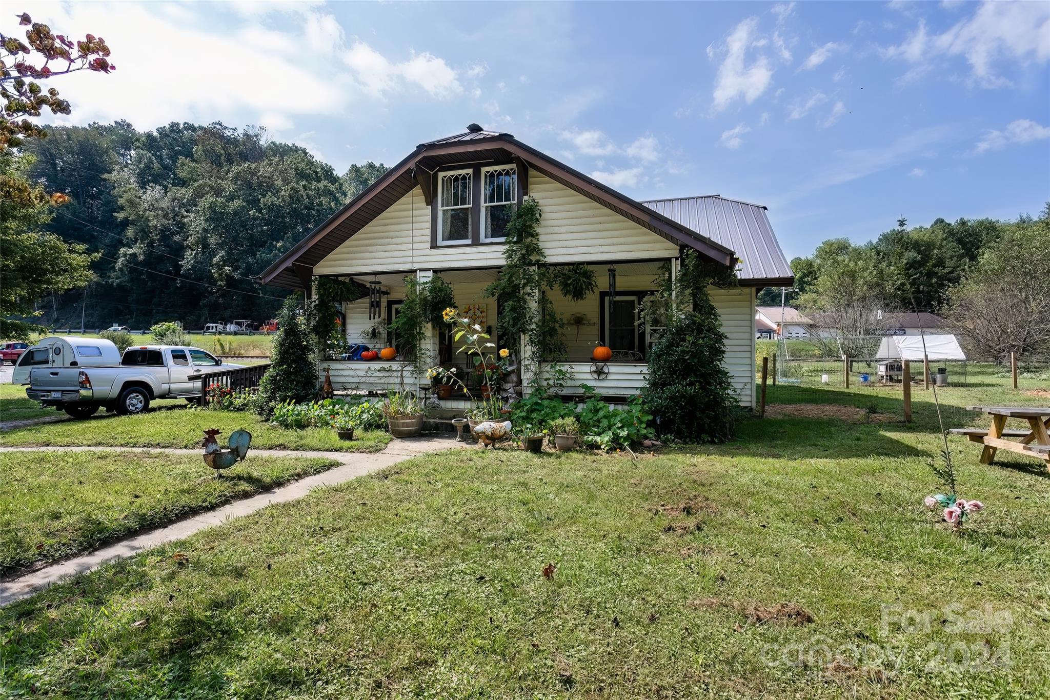 3786 Broad Street Clyde, NC 28721 - Photo 2 of 48 a front view of house with yard and green space