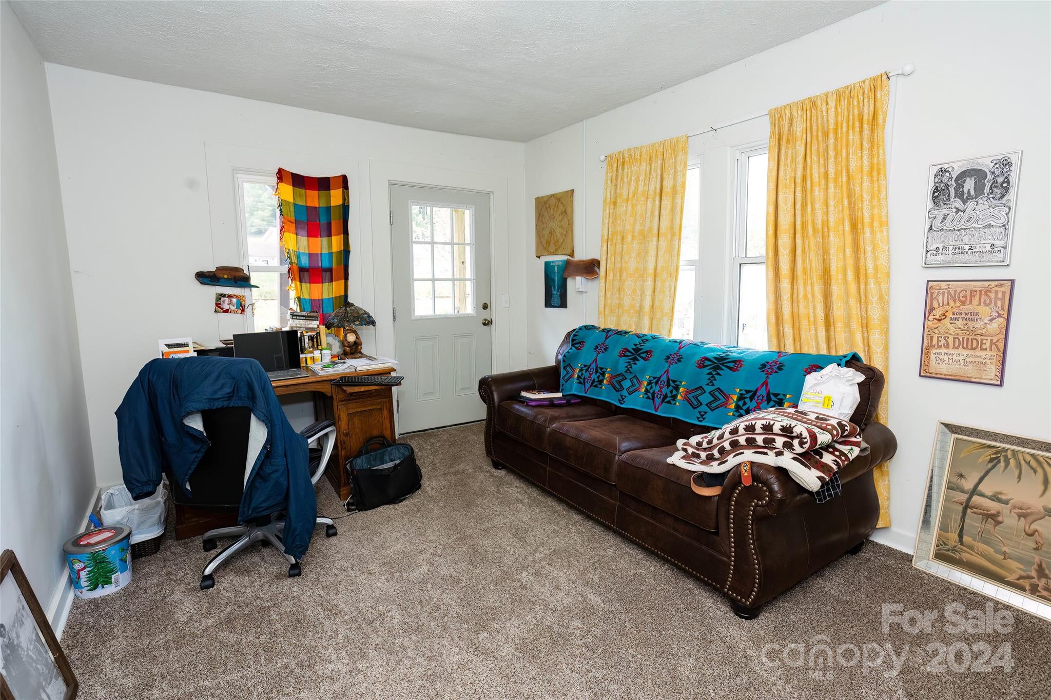 3786 Broad Street Clyde, NC 28721 - Photo 22 of 48 a living room with furniture and a window