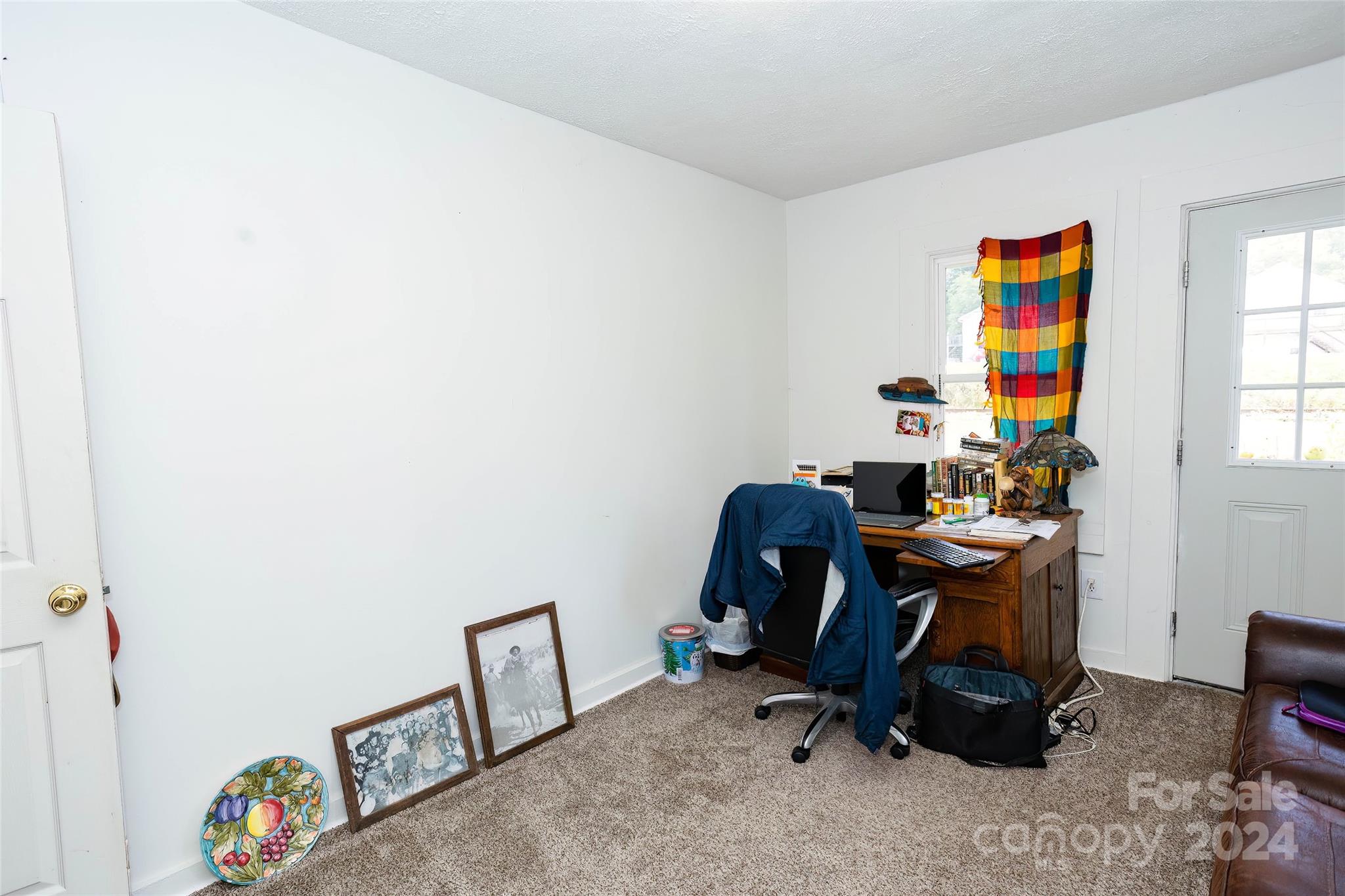 3786 Broad Street Clyde, NC 28721 - Photo 24 of 48 a view of a workspace with furniture and a window
