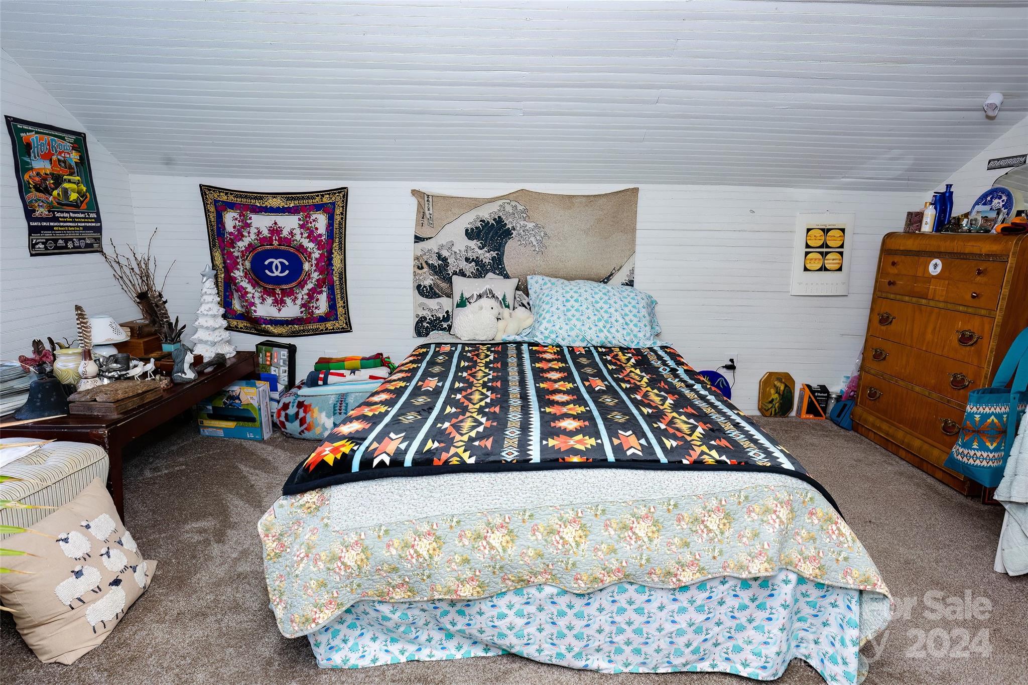 3786 Broad Street Clyde, NC 28721 - Photo 31 of 48 a bed sitting in a bedroom next to a window