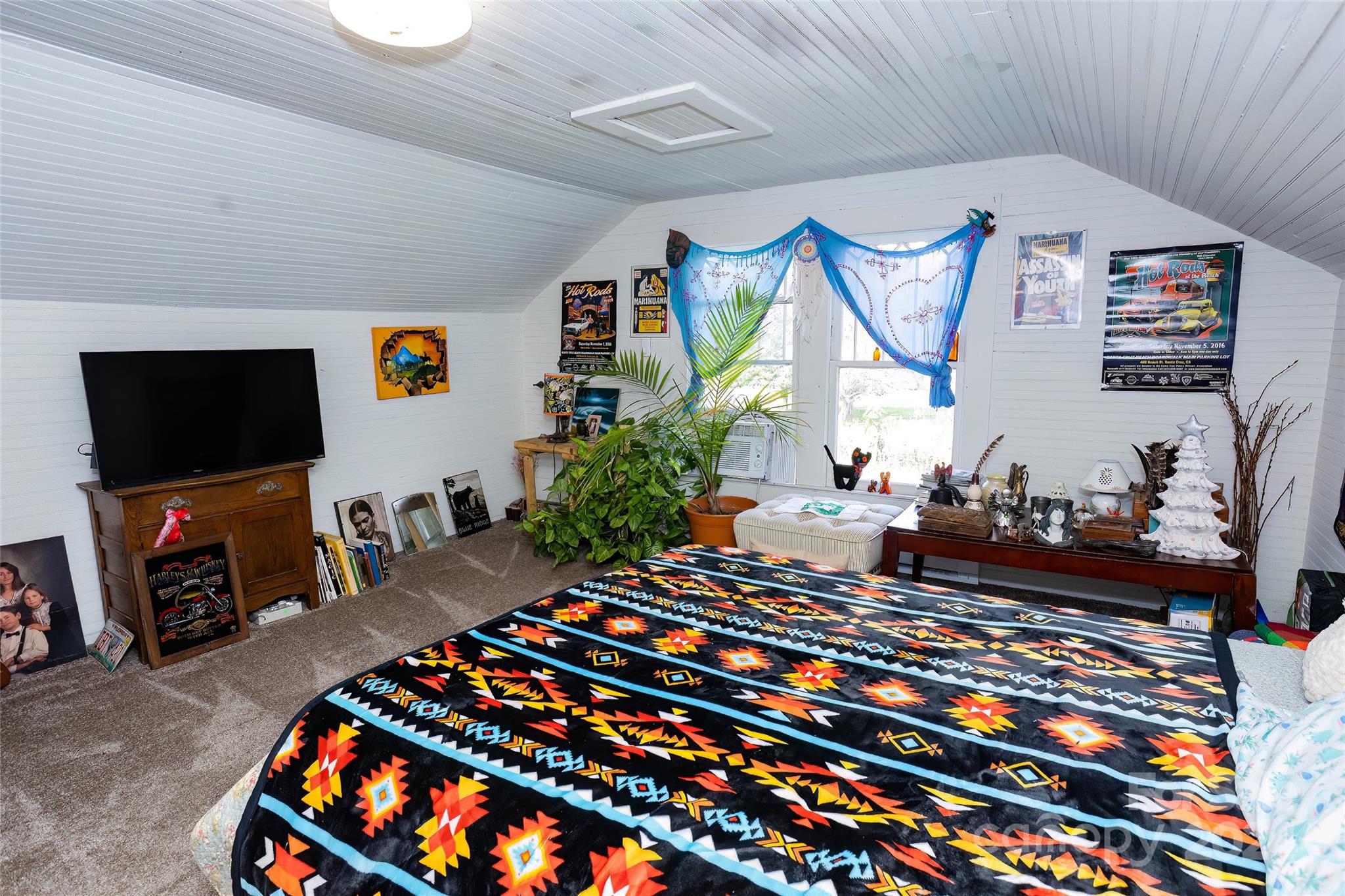 3786 Broad Street Clyde, NC 28721 - Photo 32 of 48 a room with lots of stuff and a flat screen tv