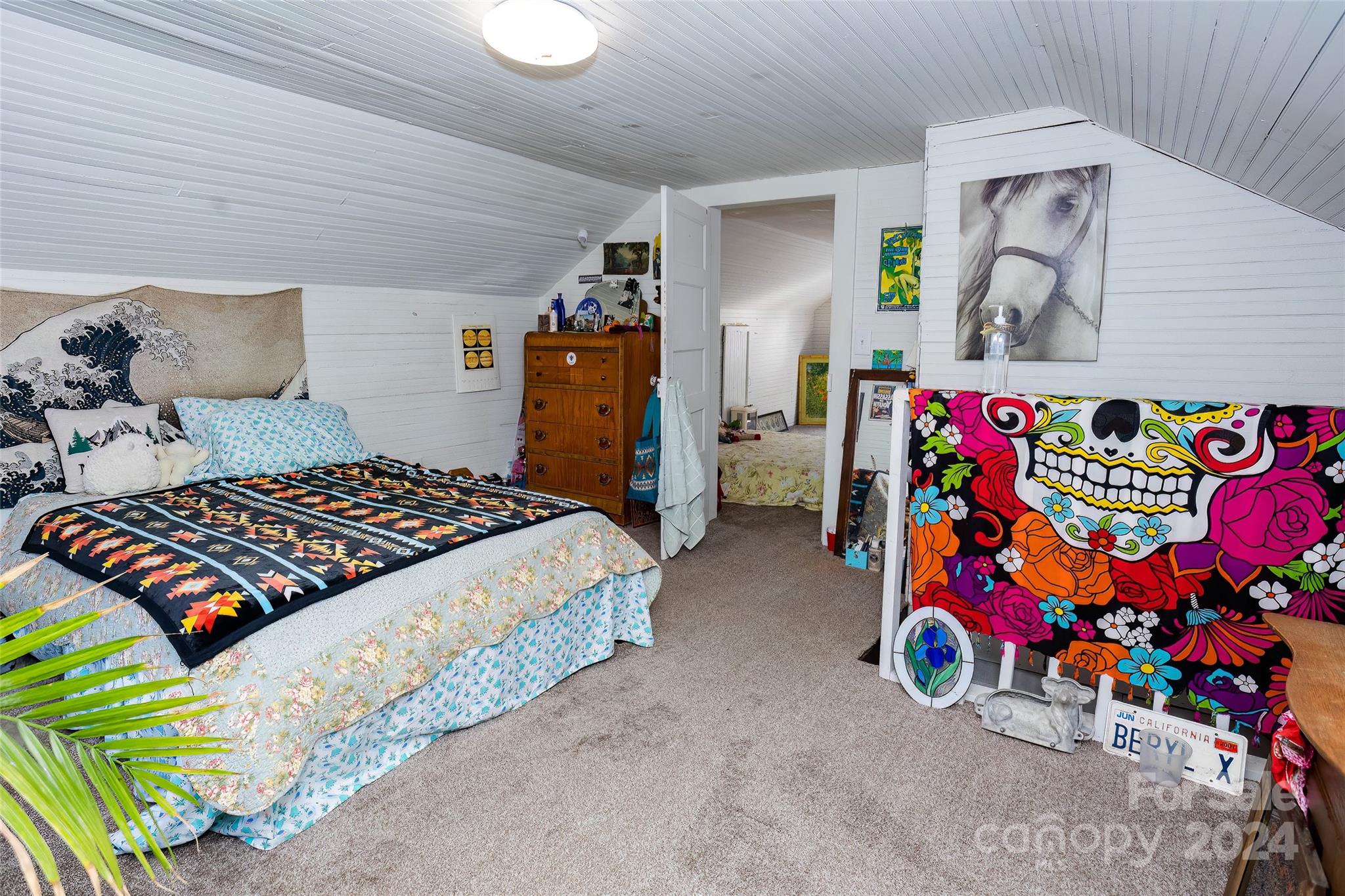 3786 Broad Street Clyde, NC 28721 - Photo 33 of 48 a bedroom with bed and a couch