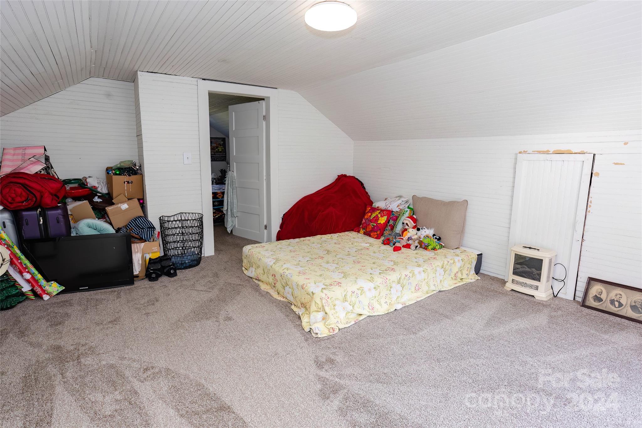 3786 Broad Street Clyde, NC 28721 - Photo 36 of 48 a bedroom with a bed and a window