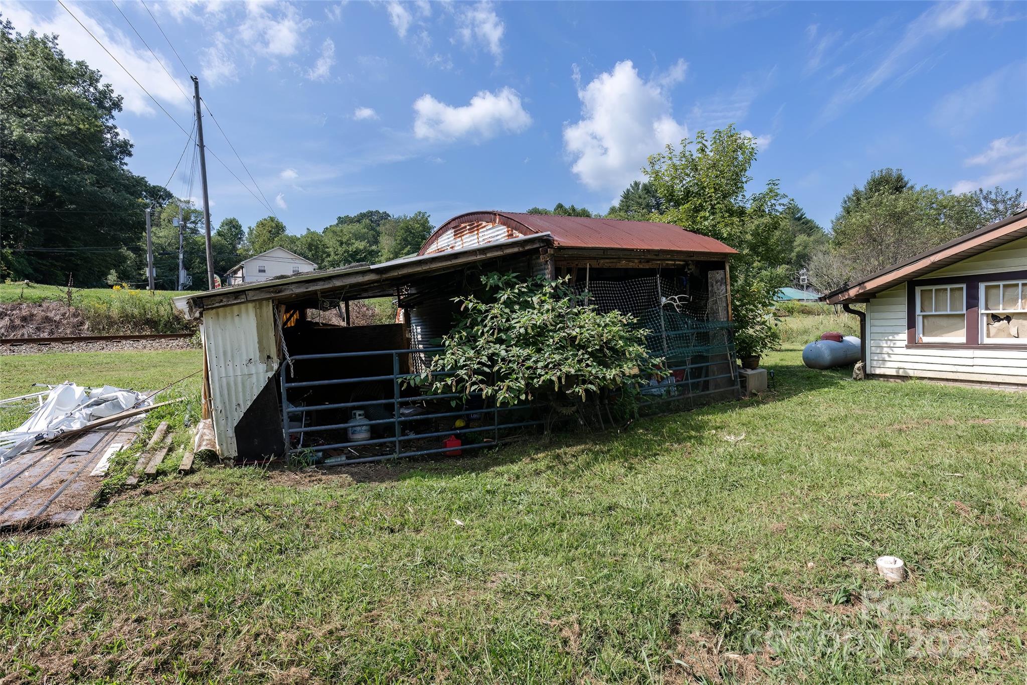 3786 Broad Street Clyde, NC 28721 - Photo 43 of 48 a view of a backyard with sitting area