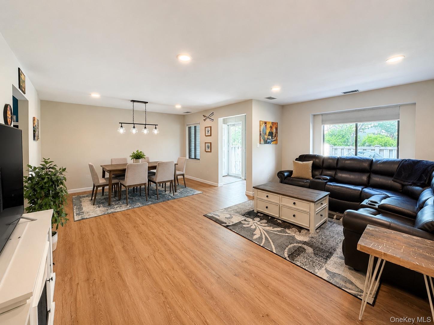 201 Birchwood Road, Unit 201 Coram, NY 11727 - Photo 3 of 27 a living room with furniture and a wooden floor