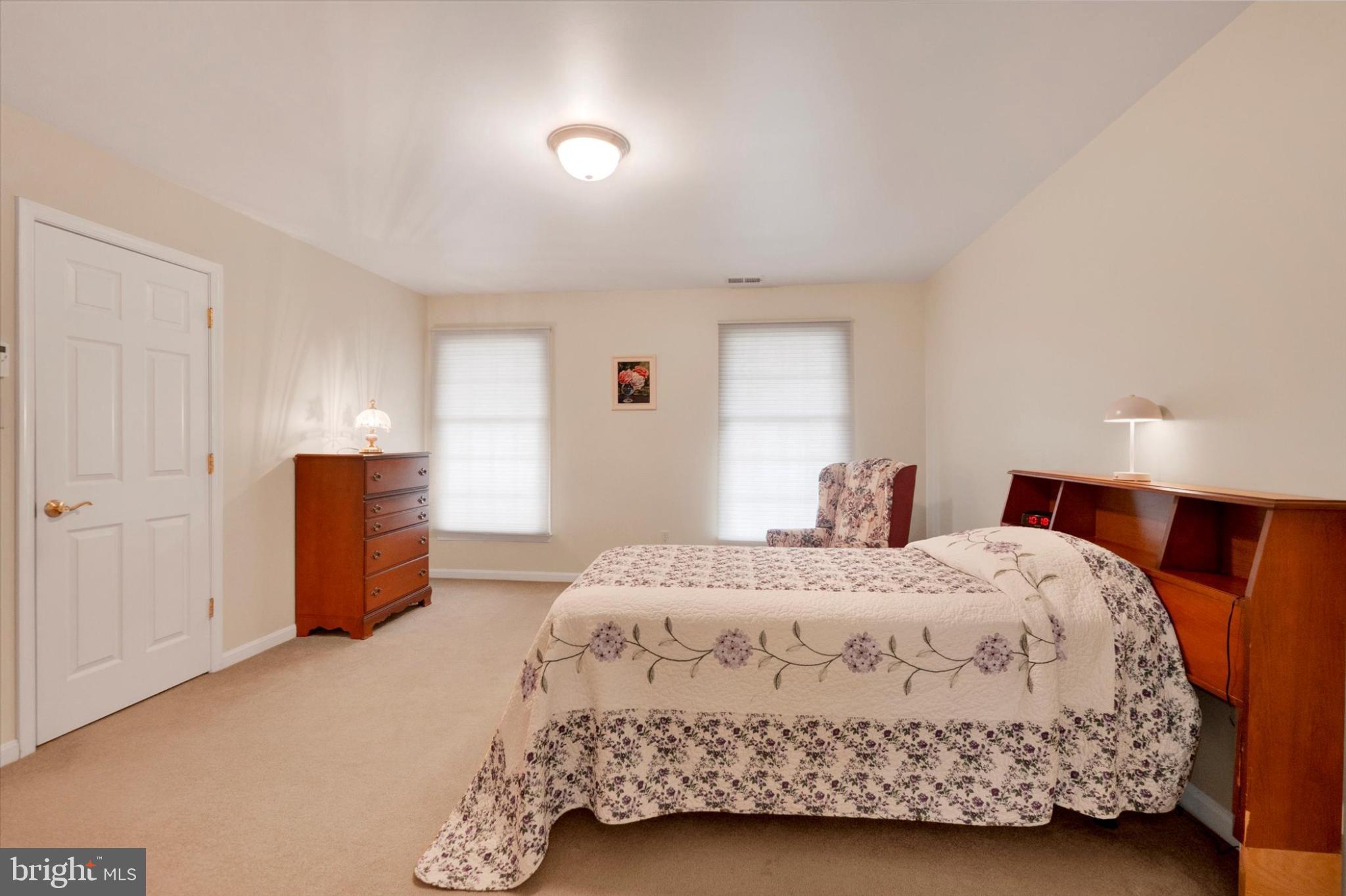 13323 Maugansville Road Hagerstown, MD 21740 - Photo 11 of 27 a bedroom with a bed and a refrigerator