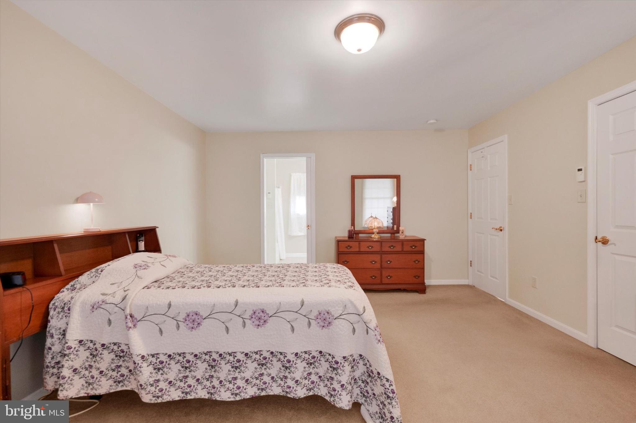 13323 Maugansville Road Hagerstown, MD 21740 - Photo 12 of 27 a bedroom with a bed and a dresser