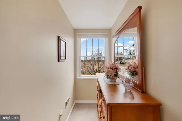 a view of a dining room with furniture and window