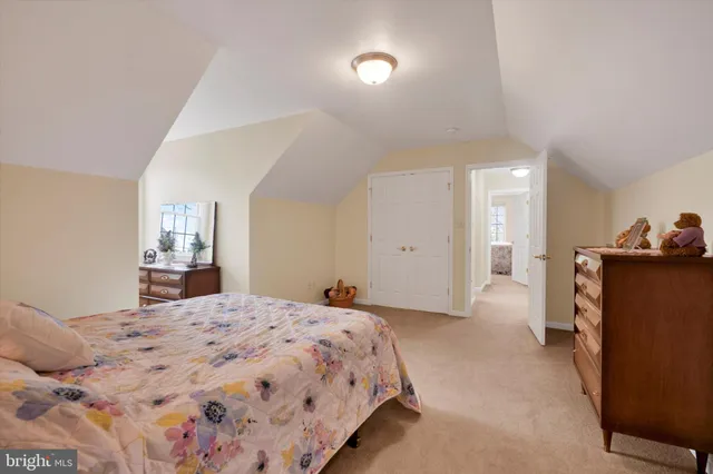 a bedroom with a bed and a lamp