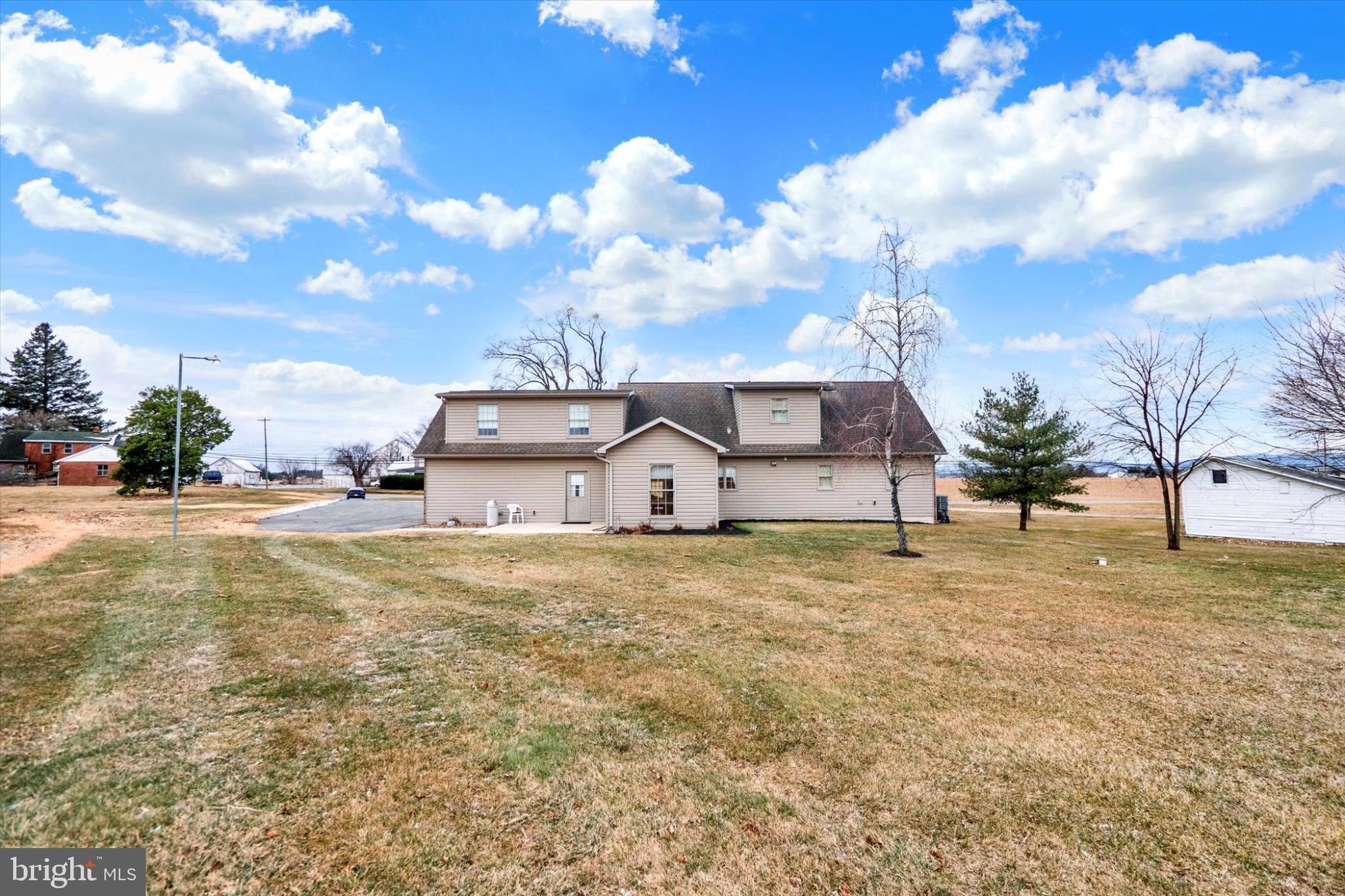 13323 Maugansville Road Hagerstown, MD 21740 - Photo 26 of 27 a view of a house with a yard