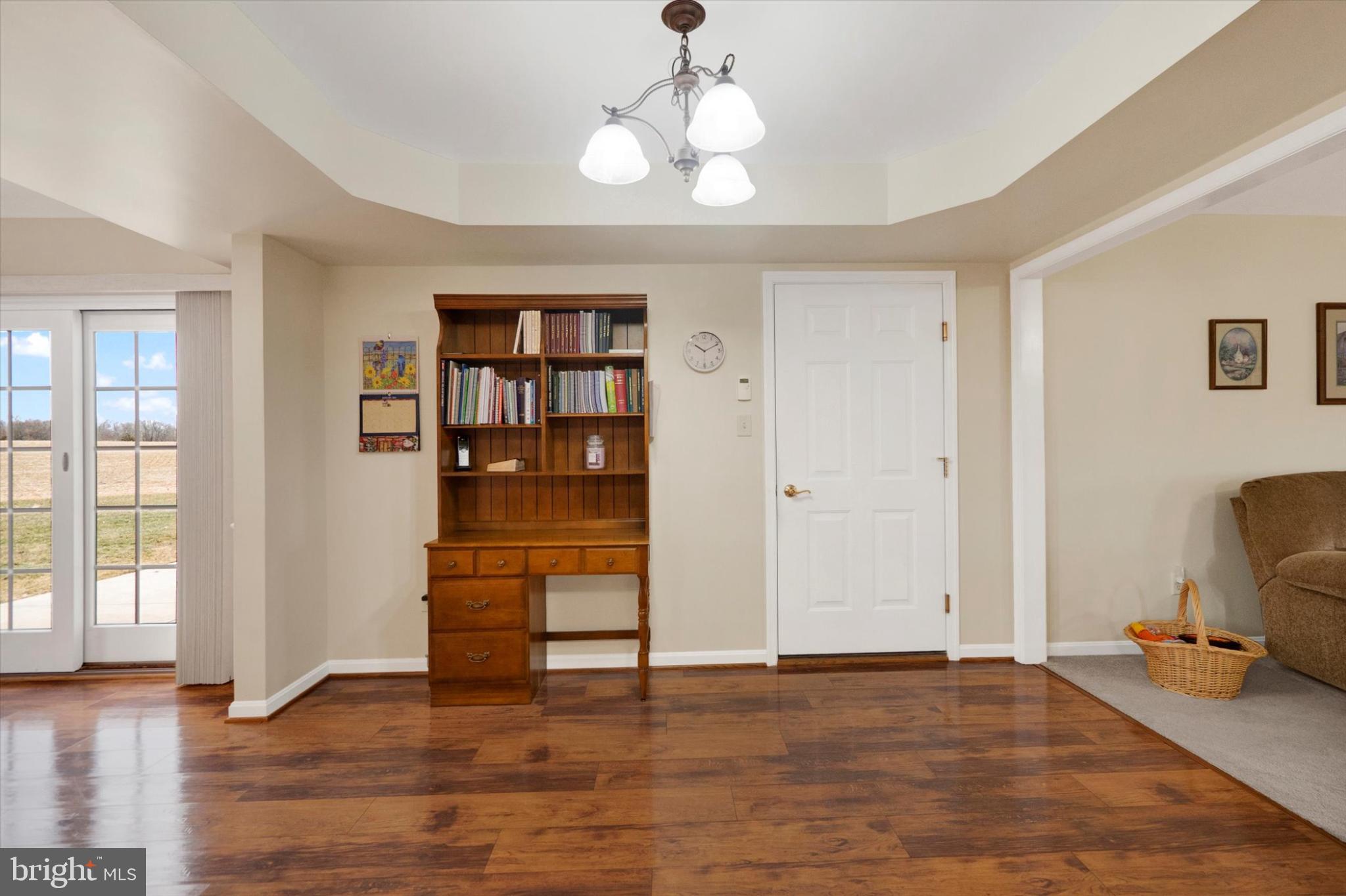 13323 Maugansville Road Hagerstown, MD 21740 - Photo 7 of 27 a view of empty room with wooden floor and fan