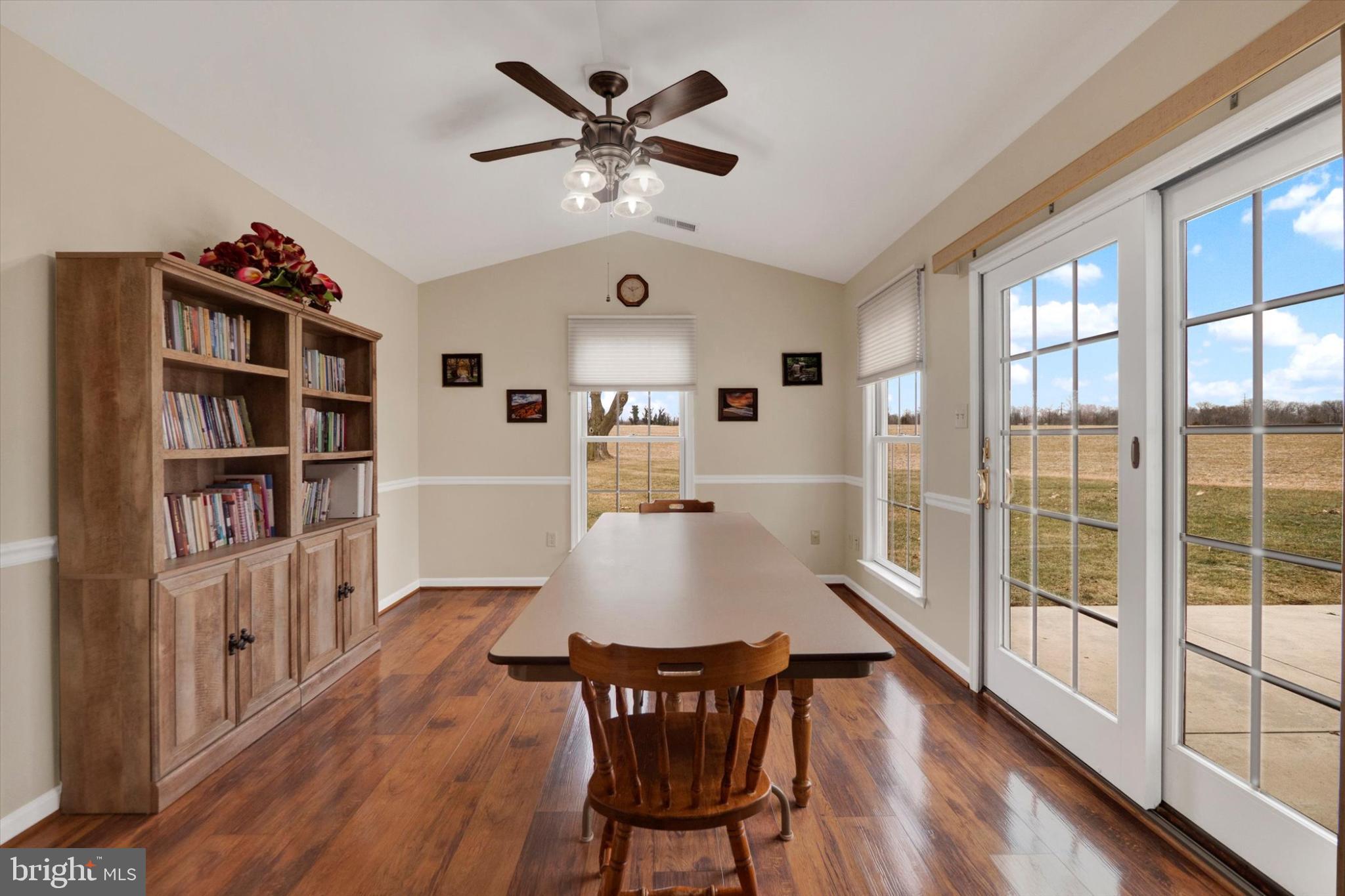 13323 Maugansville Road Hagerstown, MD 21740 - Photo 8 of 27 a living room with furniture a bookshelf and a window