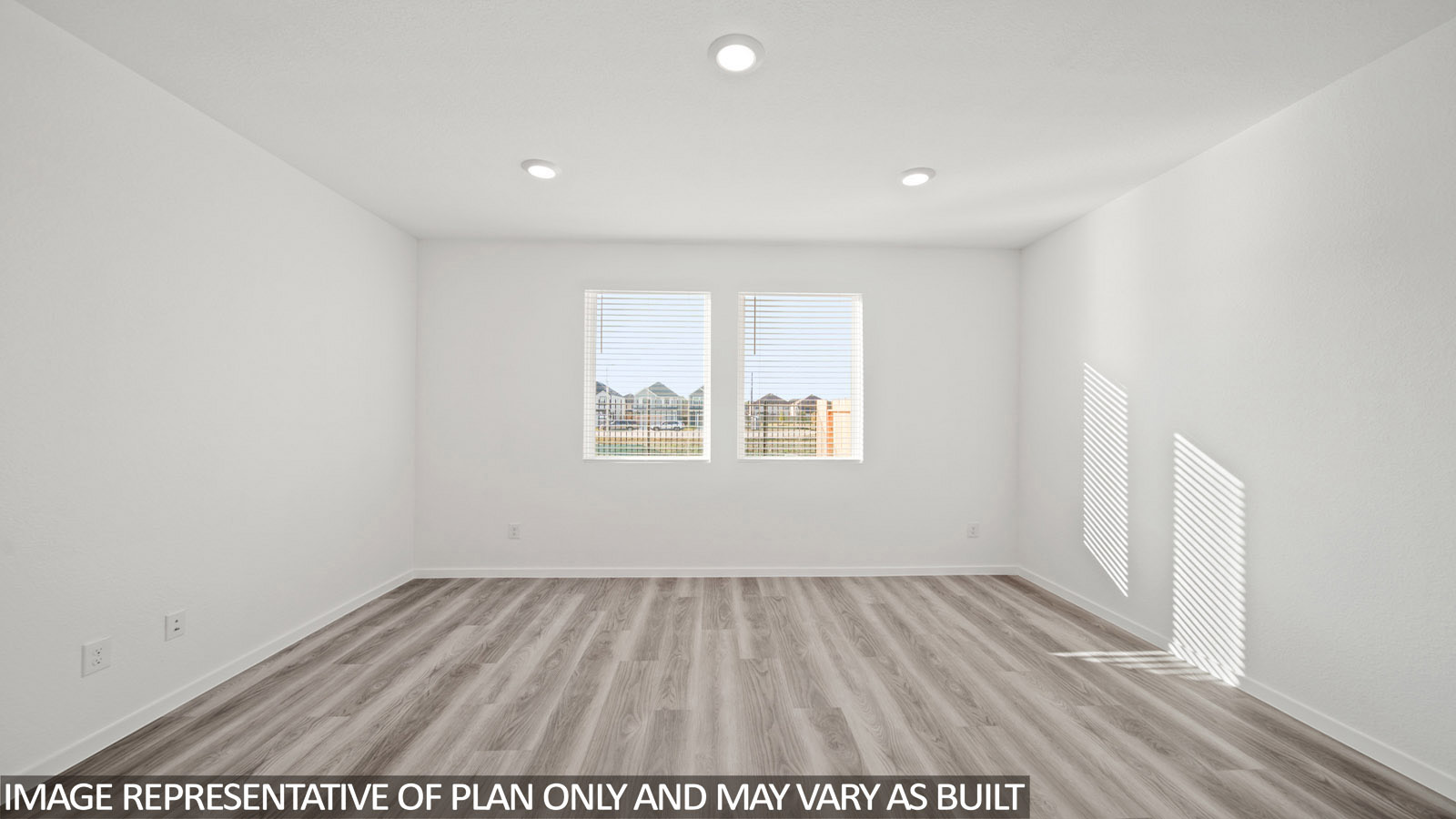 220 Flying Tigers Trail Jarrell, TX 76537 - Photo 10 of 21 Spacious room with wood-finish flooring, two windows, recessed lighting, and white baseboards