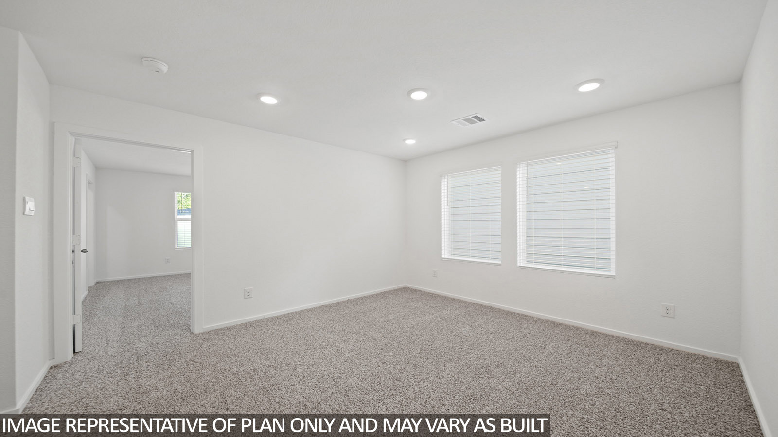 220 Flying Tigers Trail Jarrell, TX 76537 - Photo 12 of 21 Carpeted room with recessed lighting, multiple windows featuring horizontal blinds, and a doorway opening into another carpeted room