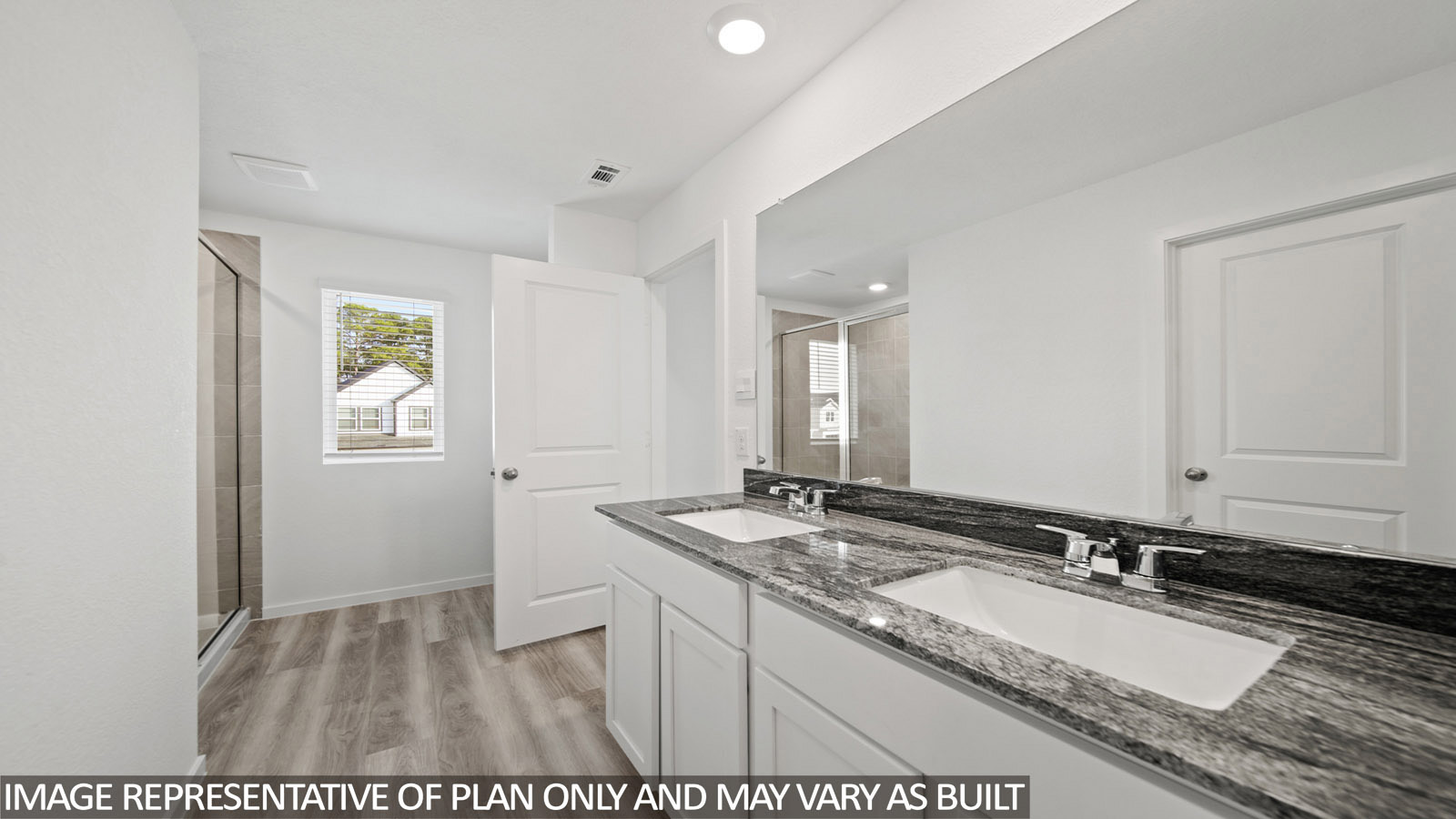 220 Flying Tigers Trail Jarrell, TX 76537 - Photo 15 of 21 Bathroom featuring a dual vanity with a patterned countertop, integrated rectangular sinks, and chrome fixtures