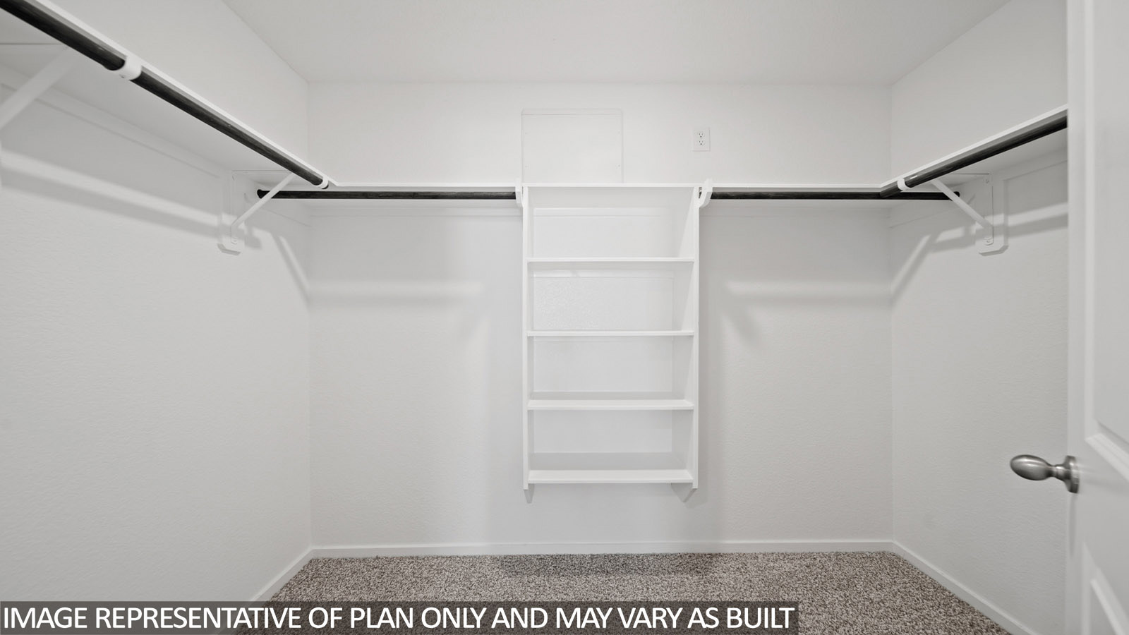 220 Flying Tigers Trail Jarrell, TX 76537 - Photo 16 of 21 Walk-in closet with integrated shelving system, multiple hanging rods, and textured carpet flooring