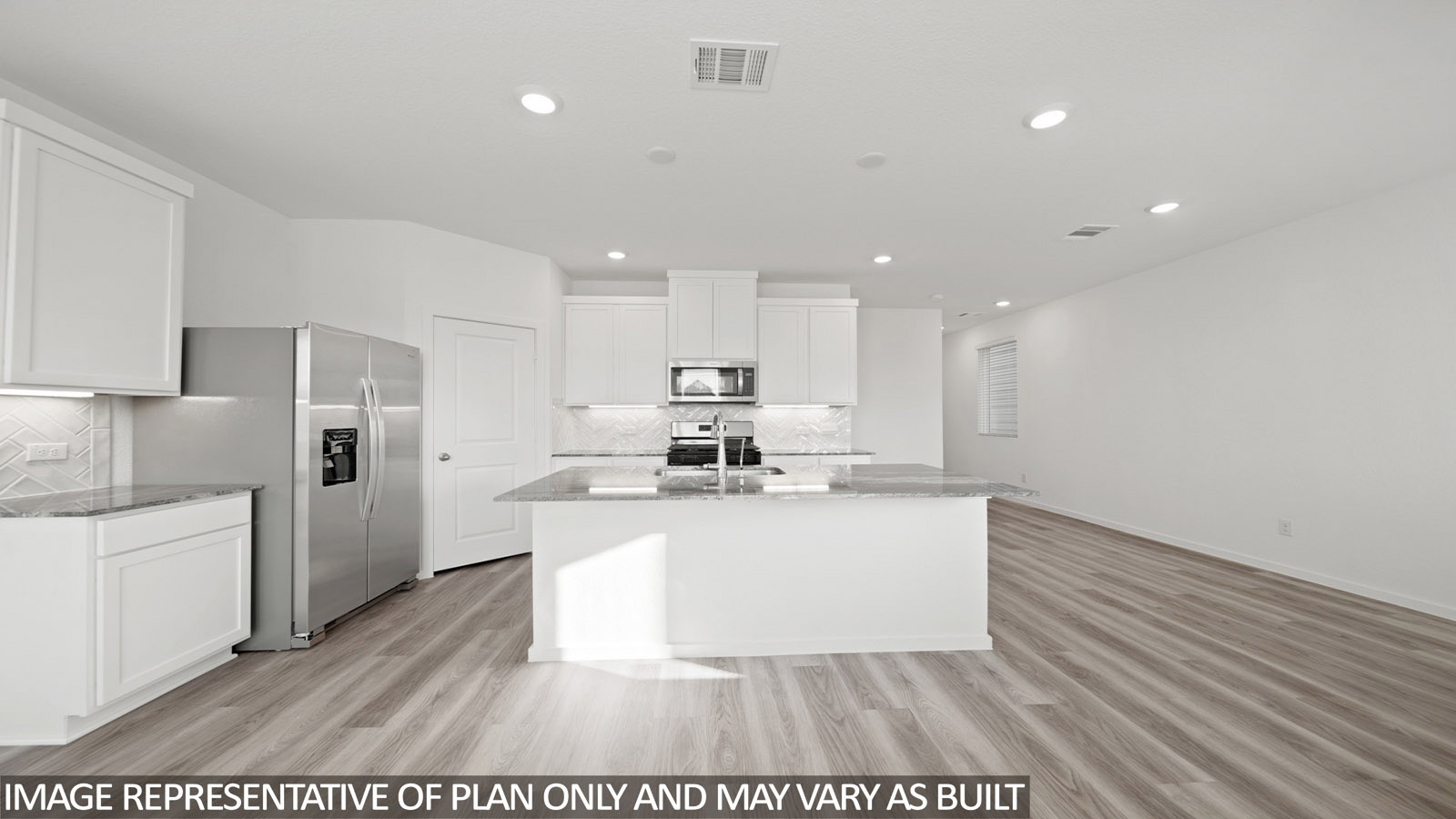 220 Flying Tigers Trail Jarrell, TX 76537 - Photo 4 of 21 Kitchen featuring an island with a sink, stainless steel appliances, recessed lighting, white cabinetry, and wood-finish flooring