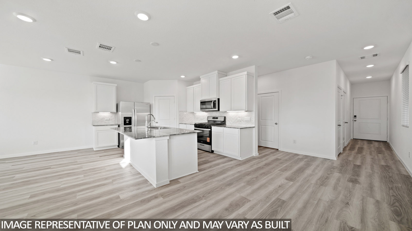 220 Flying Tigers Trail Jarrell, TX 76537 - Photo 6 of 21 Open-concept kitchen and living area featuring wood-finish flooring, white cabinetry, a kitchen island with stone countertops, stainless steel appliances, and recessed lighting