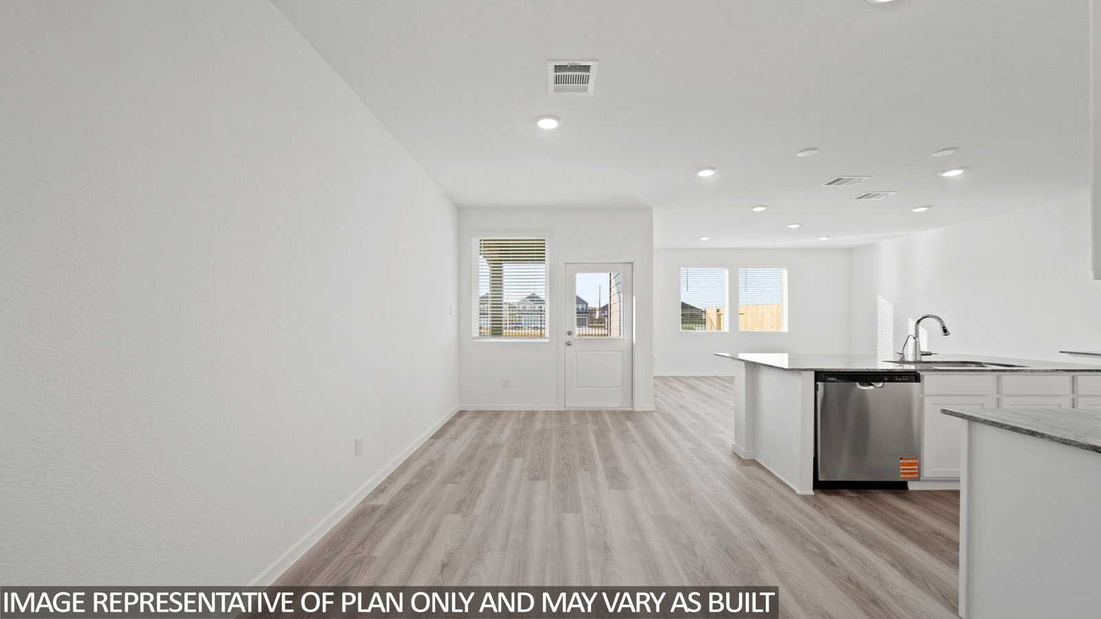 220 Flying Tigers Trail Jarrell, TX 76537 - Photo 7 of 21 Expansive open-concept room featuring wood-finish flooring, recessed lighting, and bright white walls
