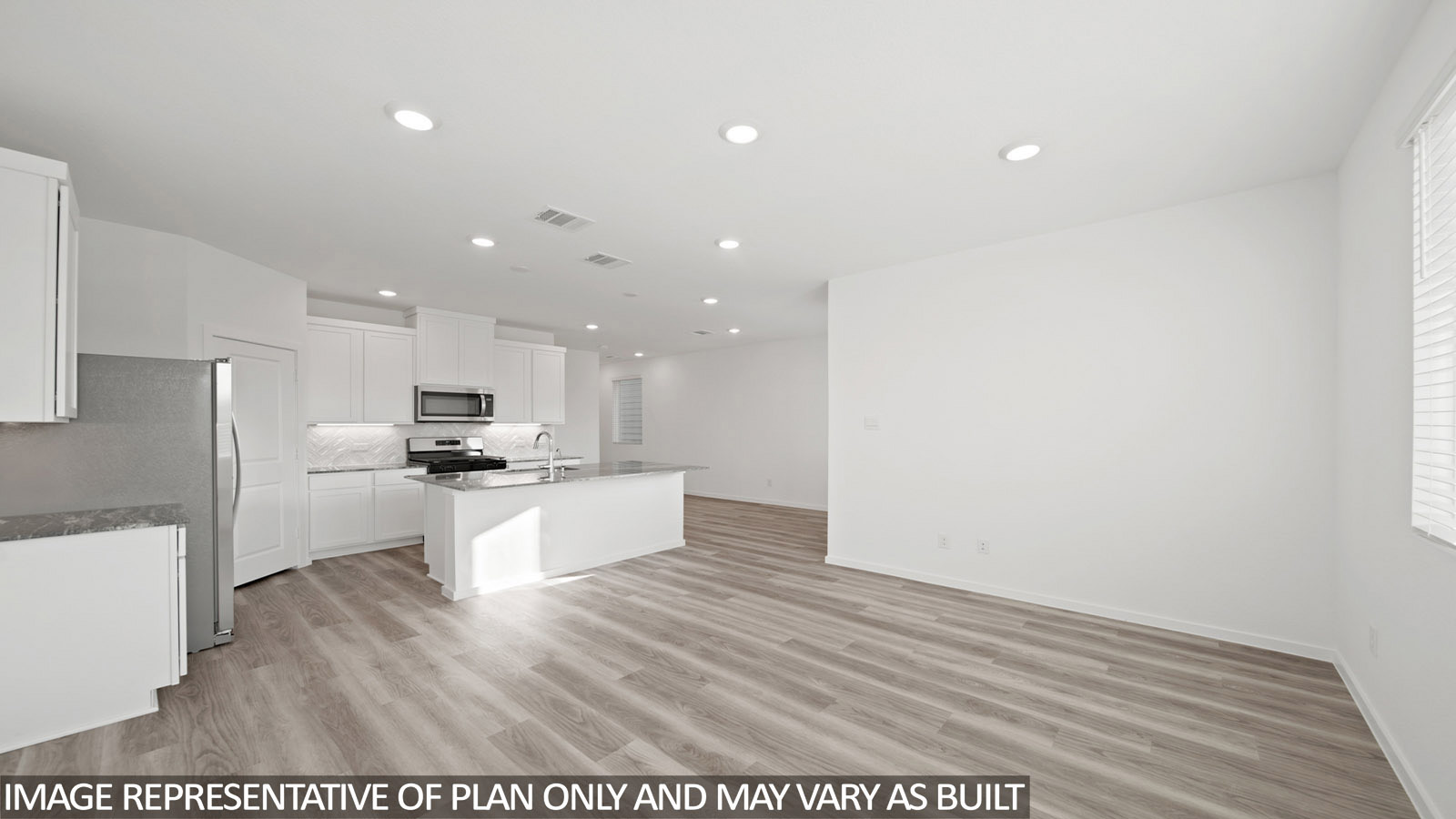 220 Flying Tigers Trail Jarrell, TX 76537 - Photo 8 of 21 Open-concept living space featuring wood-finish flooring, recessed lighting, and white walls