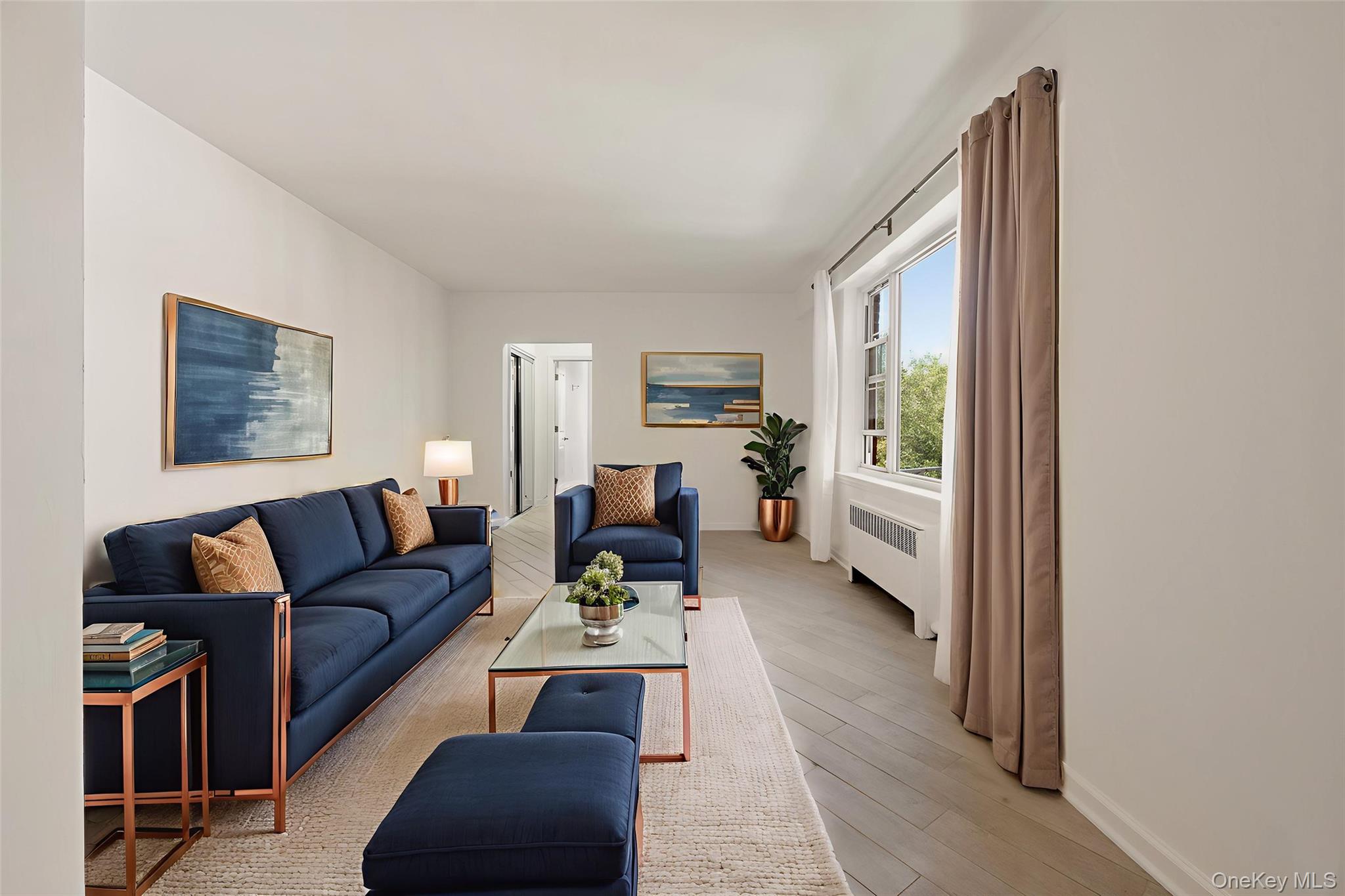 220 Pelham Road, Unit 2L New Rochelle, NY 10805 - Photo 1 of 1 Virtually staged sun drenched living room with porcelain tile floors