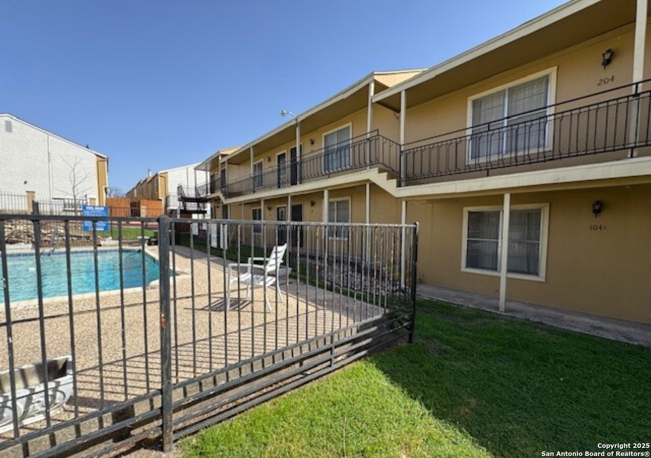 911 Vance Jackson Road, Unit 211 San Antonio, TX 78201 - Photo 7 of 8 a view of a house with a wooden deck