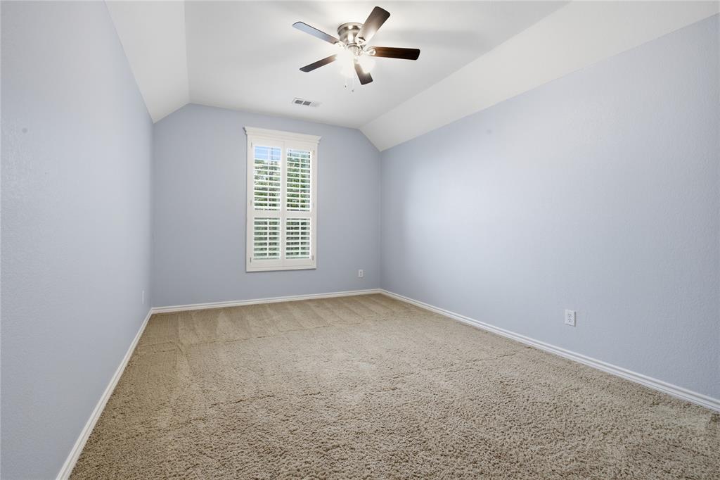 10001 Thurman Road Fort Worth, TX 76244 - Photo 26 of 40 Room featuring wall-to-wall carpeting, vaulted ceiling with a ceiling fan, and a window with white plantation shutters