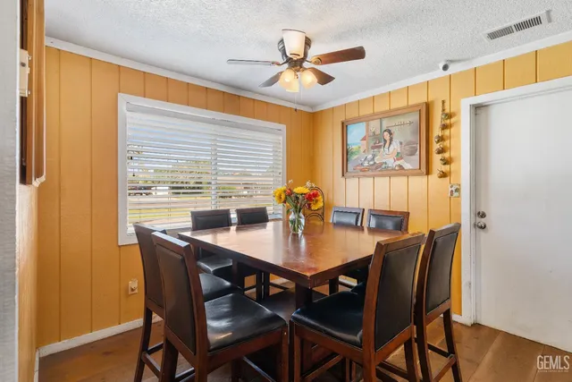a view of a dining room with furniture and window