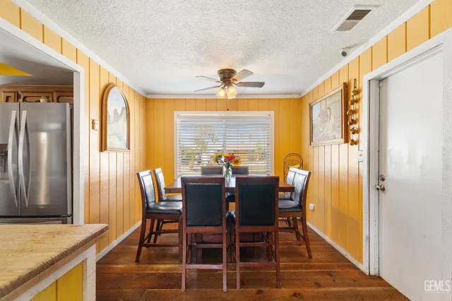 a view of a dining room with furniture and a window