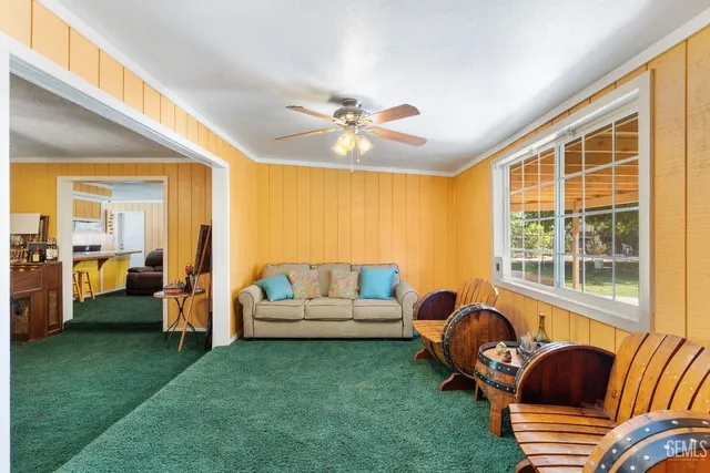 a view of a livingroom with furniture and a flat screen tv