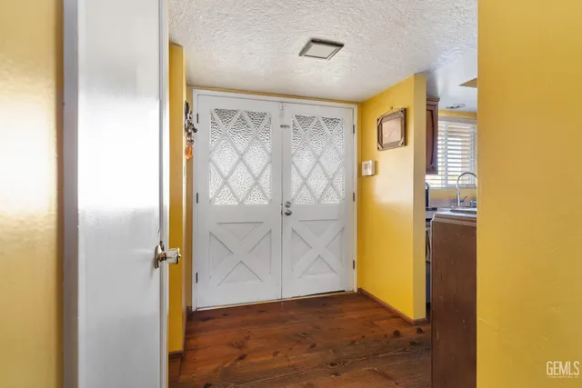 a view of front door with wooden floor