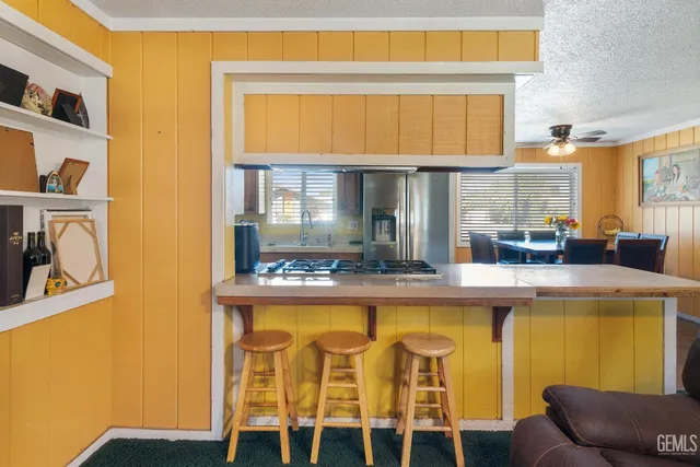a kitchen with a table and chairs in it
