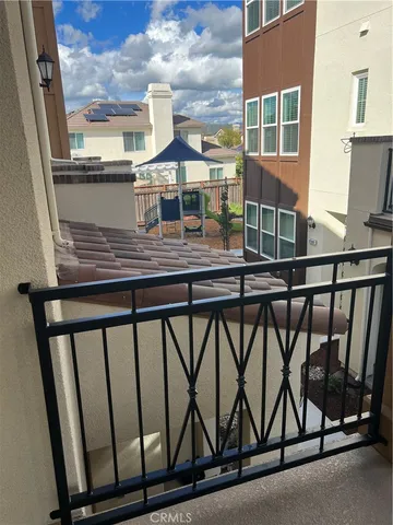 a view of a balcony with furniture