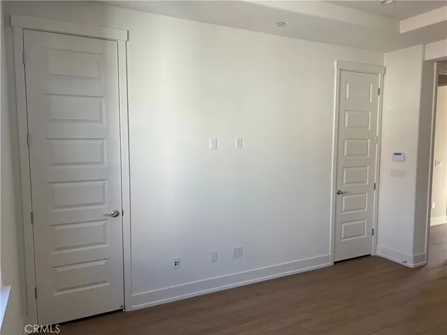 an empty room with closet area