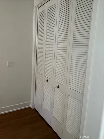 a view of a bathroom with wooden floor