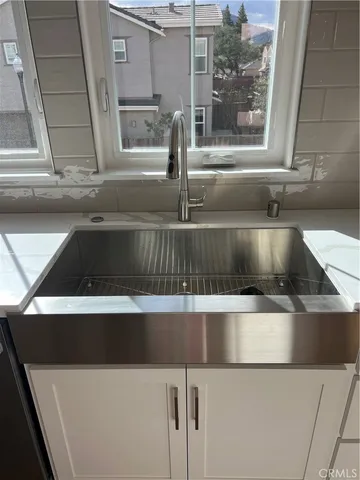 a close view of sink and washing machine