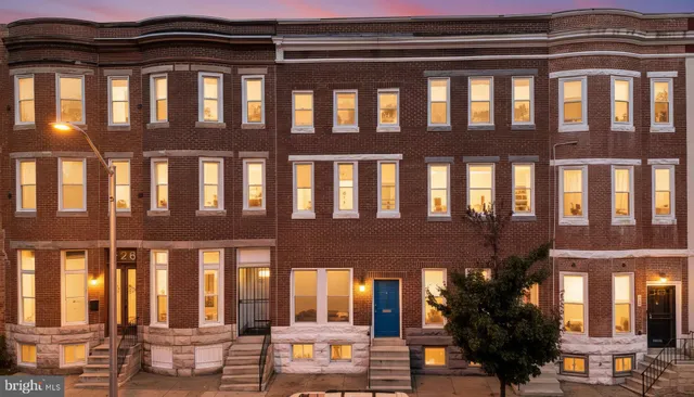 a couple of table and chairs in front of building
