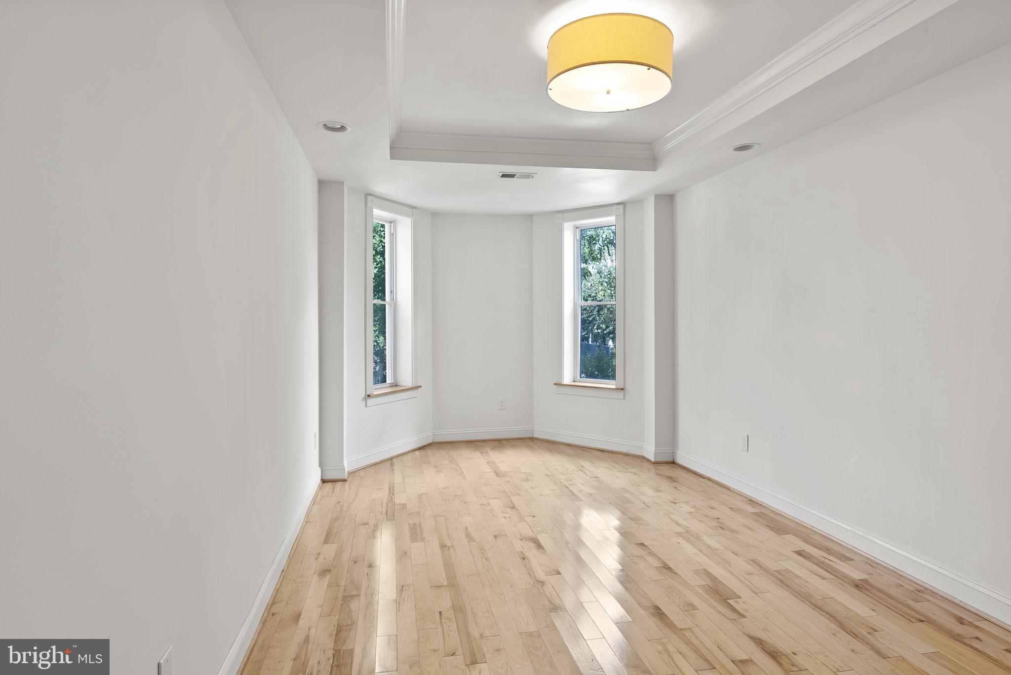 722 Lennox Street Baltimore, MD 21217 - Photo 29 of 52 wooden floor in an empty room with a window