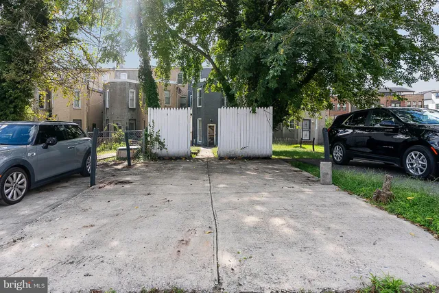 a view of a car parked in front of a house
