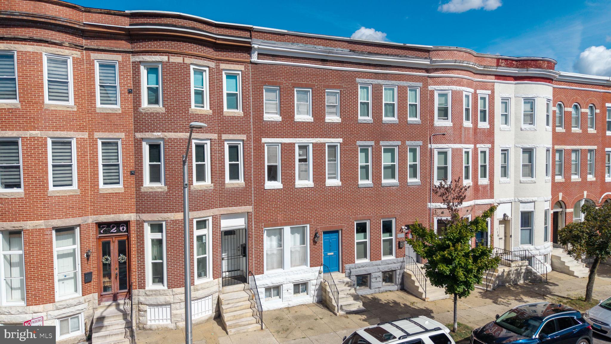 722 Lennox Street Baltimore, MD 21217 - Photo 43 of 52 a front view of a building with many windows