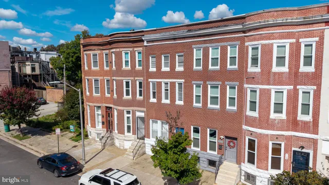 a front view of a building with parking space