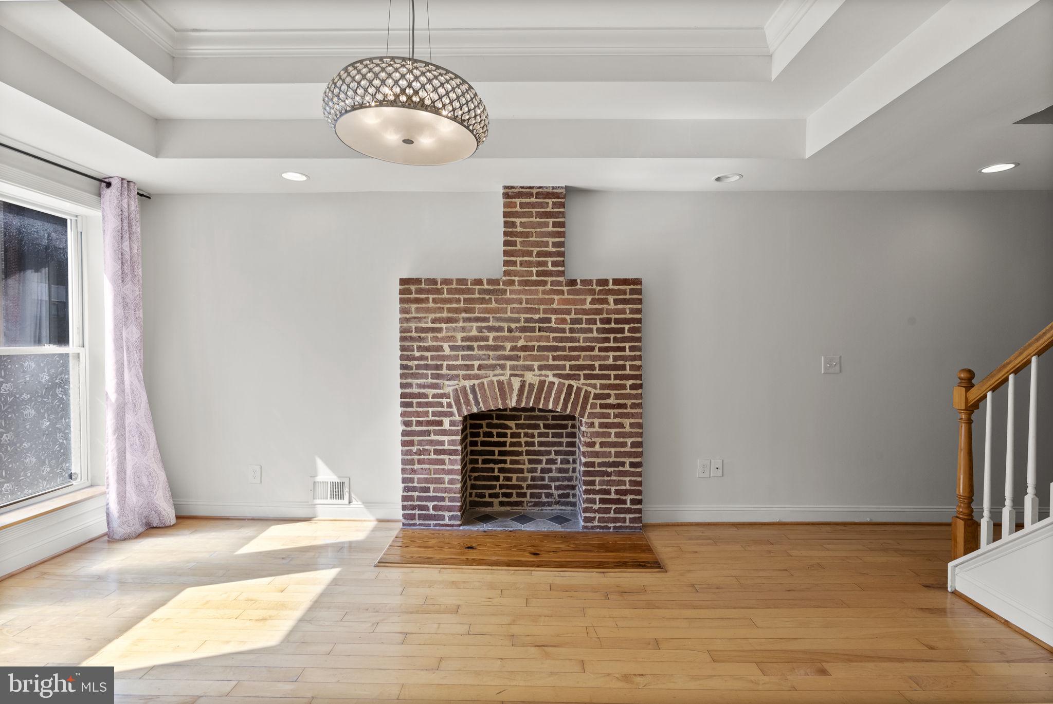 722 Lennox Street Baltimore, MD 21217 - Photo 7 of 52 a view of livingroom with wooden floor