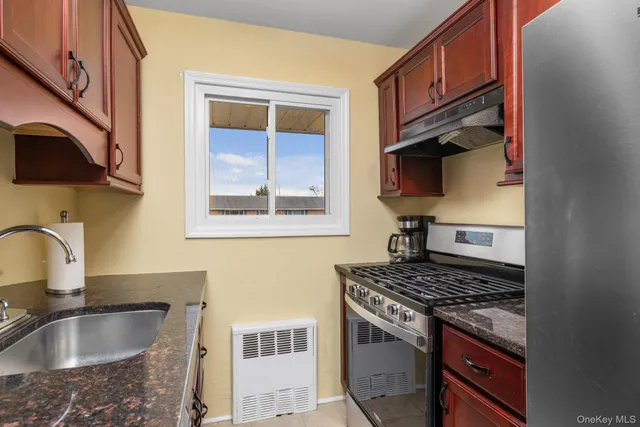 a kitchen with a stove and a sink