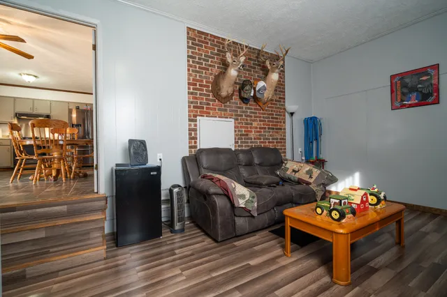 a kitchen with a sink a stove and a window