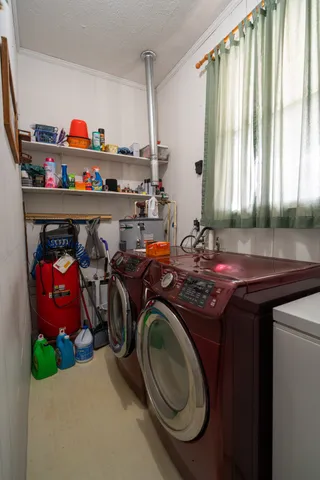 a kitchen with stainless steel appliances granite countertop a stove a sink a refrigerator and island