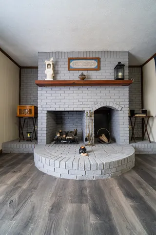 a view of a livingroom with furniture and a ceiling fan