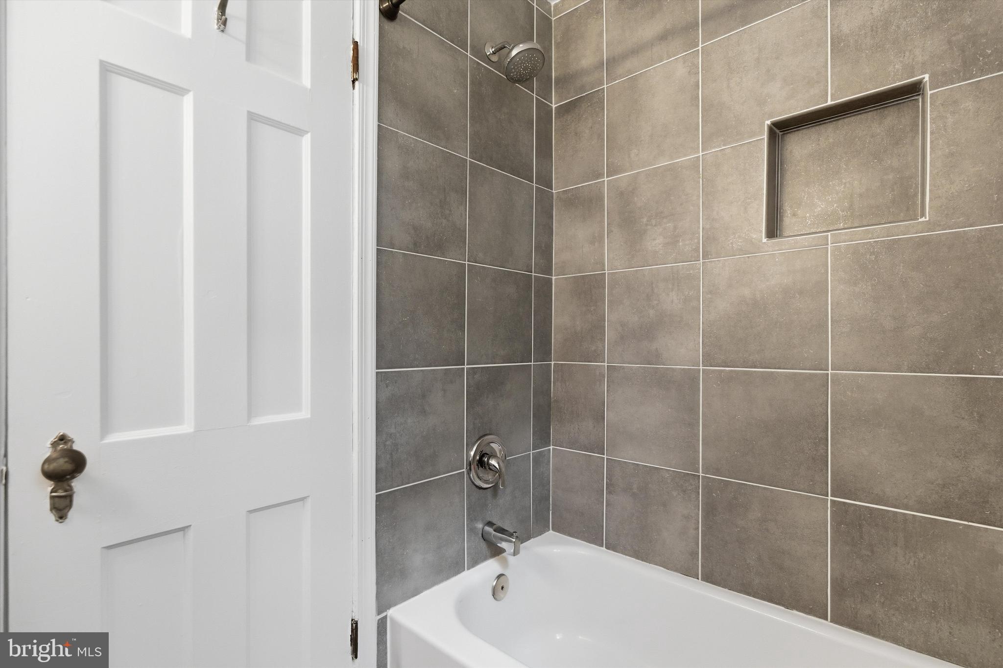 1909 North Rhodes Street, Unit 25 Arlington, VA 22201 - Photo 14 of 16 a bathroom with a bathtub