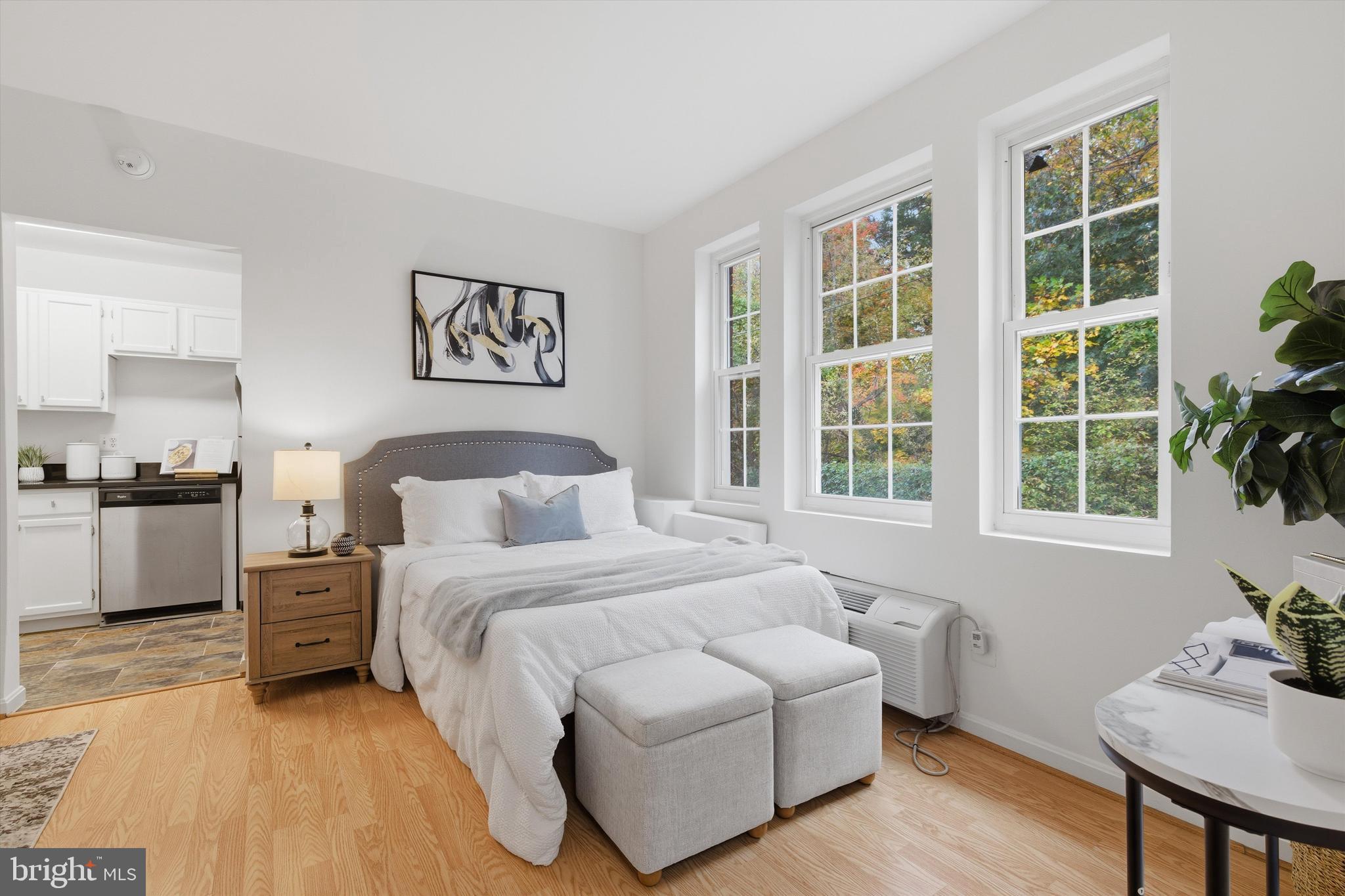 1909 North Rhodes Street, Unit 25 Arlington, VA 22201 - Photo 6 of 16 a bedroom with a bed and a window